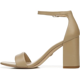 a pair of nude heel sandals with an ankle strap