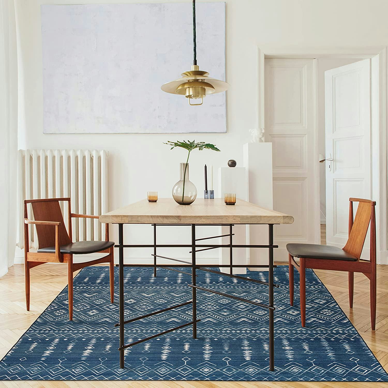 This rug under kitchen table is machine-washable and made from recycled fibers.