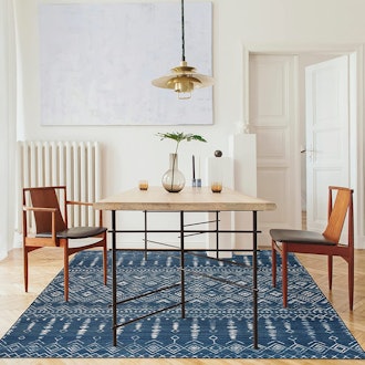 This rug under kitchen table is machine-washable and made from recycled fibers.