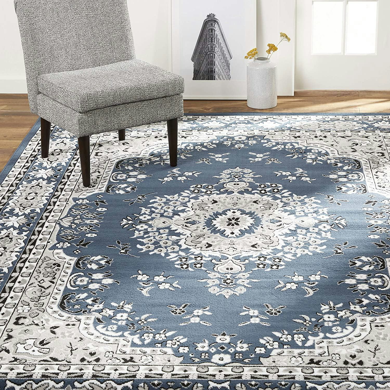 This rug under kitchen table has a formal, traditional style.