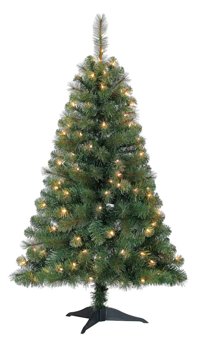 This Ashland 4' Pre-Lit Riverside Pine Artificial Christmas Tree is one of the best flame-retardant ...