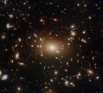 Galaxy cluster Abell 611, showcased in a Hubble Space Telescope image. Forth or so galaxies ranging ...