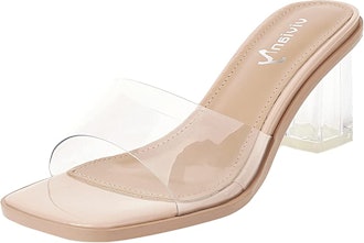 a pair of pvc heels with a nude sole