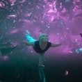 still image from animated film 'Reflect' of ballerina posing with bright pink colors behind her