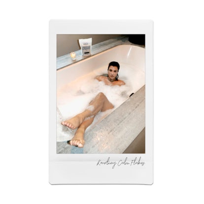 Kourtney Kardashian takes a bath with Kourtney K and Travis Barker's wellness line. 