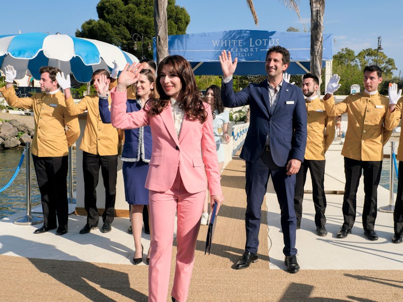 Scene from White Lotus with people waving while having smiles on their faces