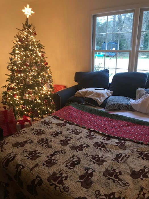 Granny Jo’s on the author’s pull-out sofa bed by her Christmas tree. Perfect for holiday movie night...