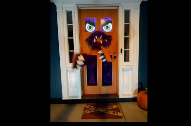 A monster door to scare trick or treaters. 