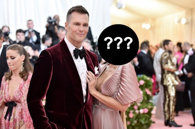 Tom Brady posing on the red carpet with a possible new girlfriend