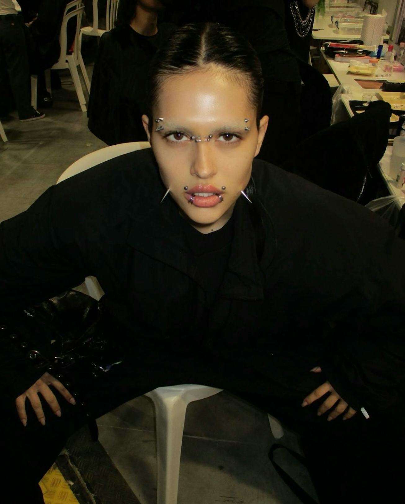 Amelia Gray with punk face piercings and black outfit at Balenciaga’s Spring/Summer 2023 show
