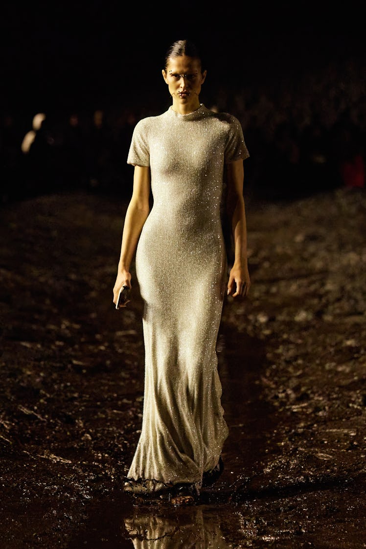 A model walking in Balenciaga’s maxi nude sequin dress with short sleeves at Paris Fashion Week Spri...