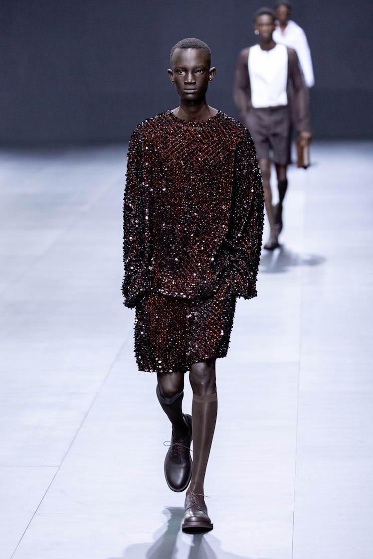 Male model wearing Valentino’s rhinestone sweatshirt-shorts combo at Paris Fashion Week Spring 2023