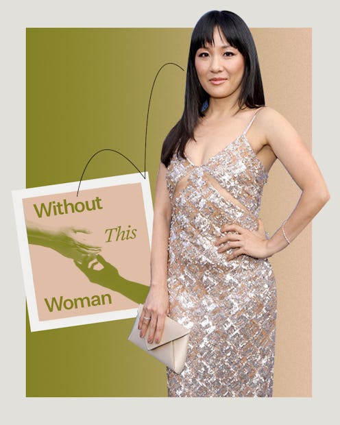 Constance Wu wearing a silver dress next to a Without This Woman sign