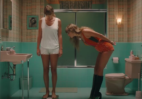 Still from Taylor Swift's 'Anti-Hero' music video showing Taylor Swift standing on a bathroom scale
