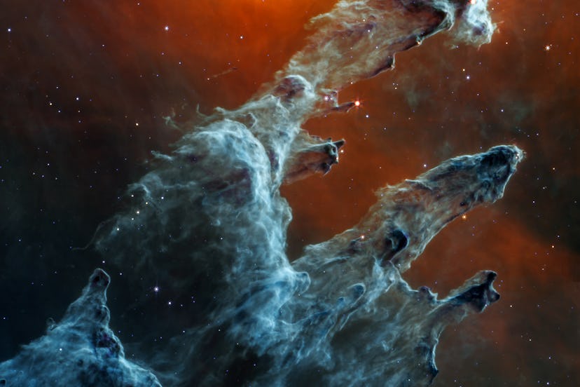 Many layers and pillars of semi-opaque gas and dust overlay one another. These regions appear light ...