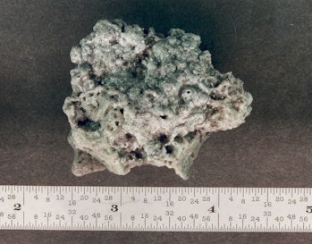 color photo of an amorphous, porous chunk of metal