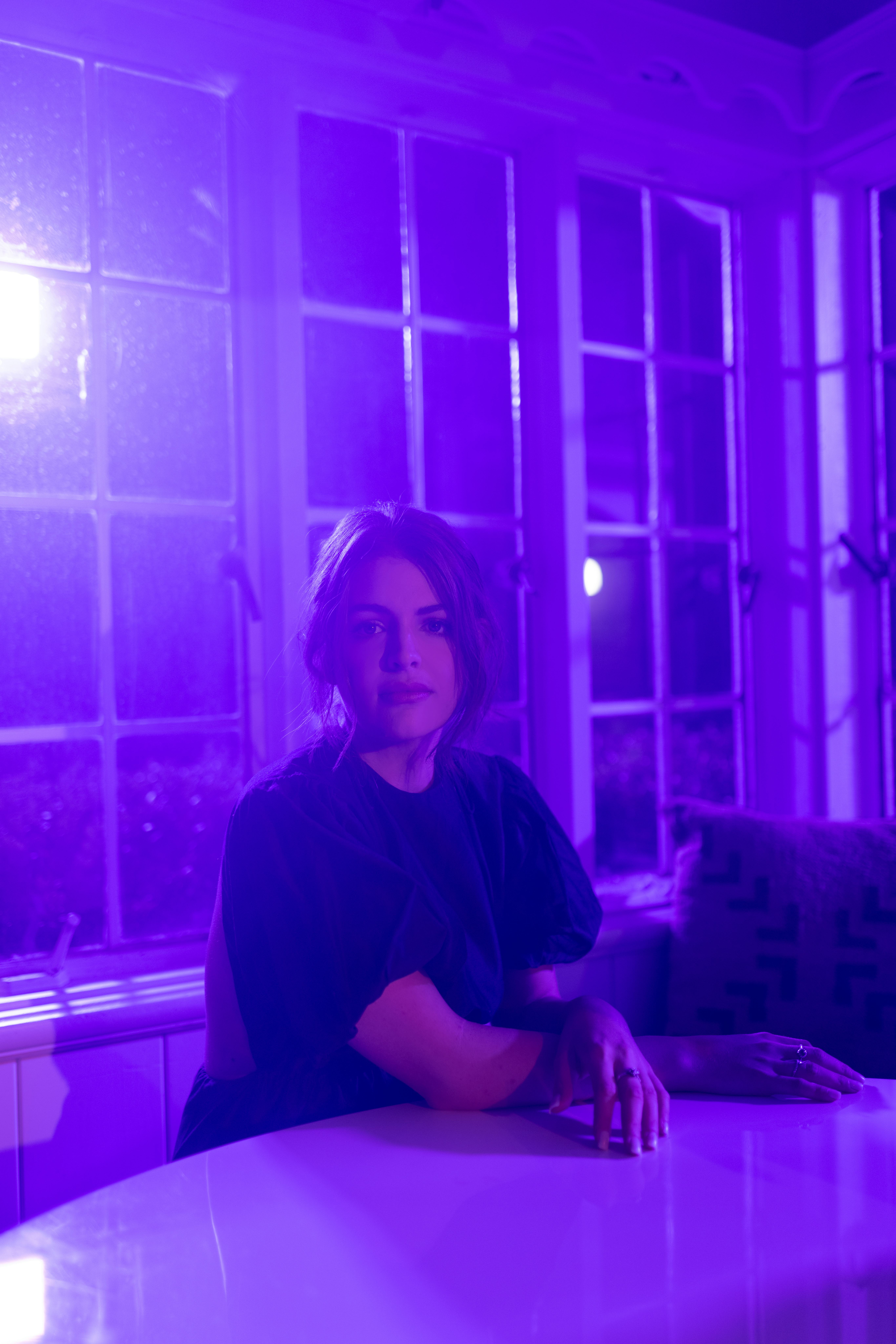 A photo of Indy, bathed in purple light