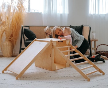 Children playing on wood climber