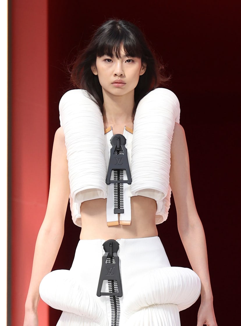 HoYeon opening the spring 2023 Louis Vuitton show in a monochrome ensemble