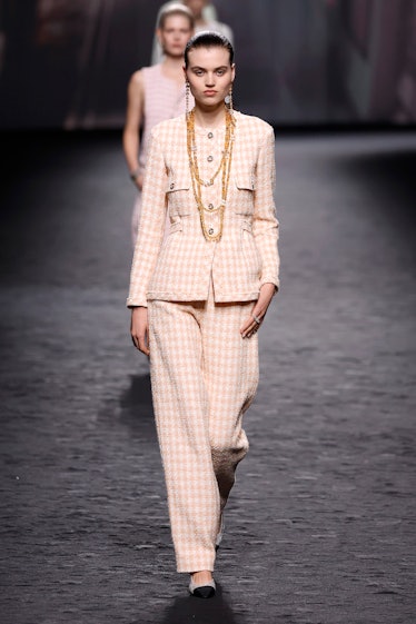 A model walks the runway during the Chanel Womenswear Spring/Summer 2023 show as part of Paris Fashi...