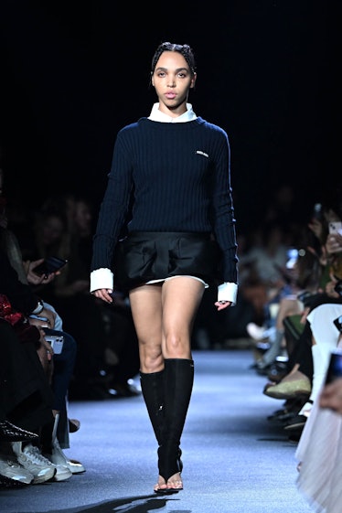 FKA Twigs walking the spring 2023 Miu Miu show in a miniskirt