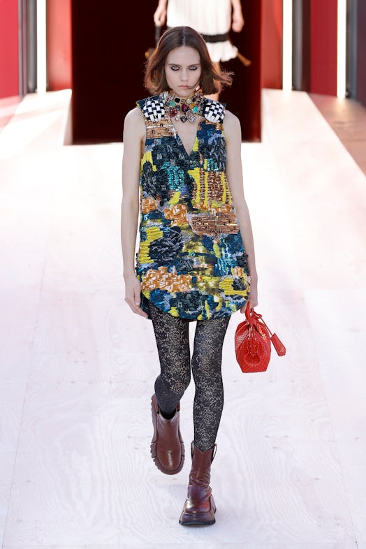A model in a yellow-blue multi-part dress at the Louis Vuitton Spring 2023 Paris Fashion Week
