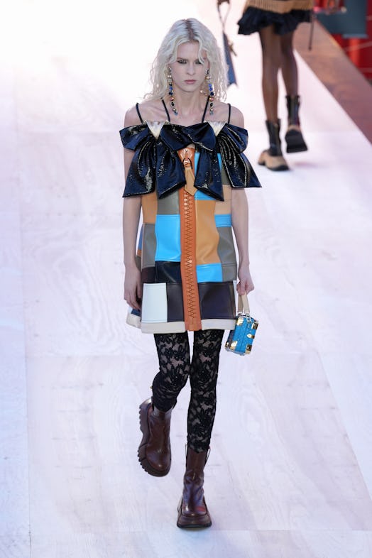 A model in a multi-color patchwork dress at the Louis Vuitton Spring 2023 Paris Fashion Week