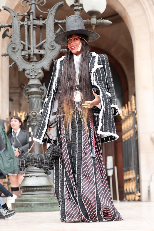 Erykah Badu wearing head to toe Thom Browne at Paris Fashion Week