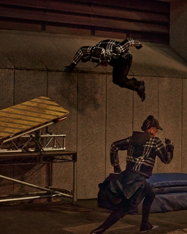 A person running up a wall in a behind-the-scenes still of a Burberry campaign