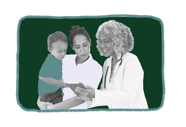 Doctor showing test results to mother and daughter
