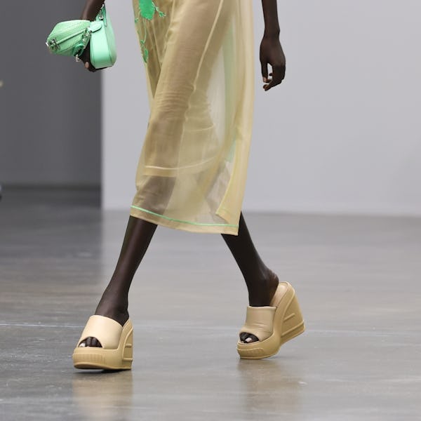 A model walks the runway of the Fendi Fashion Show wearing wedge shoe trend during the Milan Fashion...