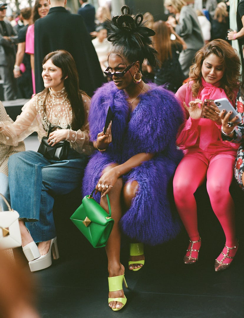 Shea Coulee wearing a purple furry jacket