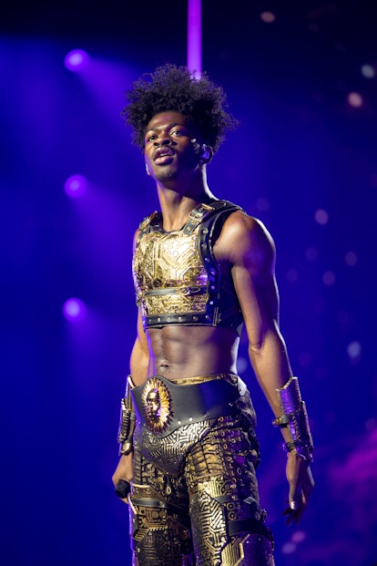 Lil Nas X wearing a concert outfit designed by Disco Daddy and Coach.
