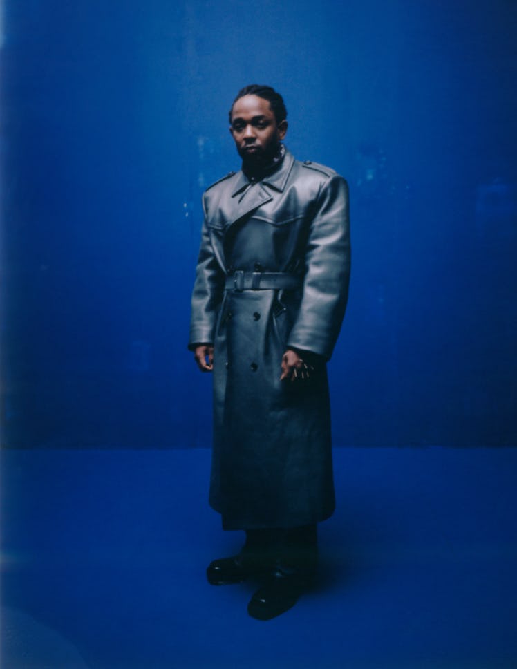 Kendrick Lamar wearing leather Prada coat, jumpsuit, and boots; Tiffany & Co. bracelets; his own ban...