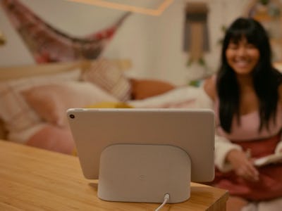 The Pixel Tablet docked in a bedroom.