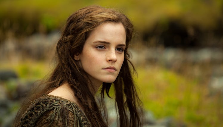 Emma Watson looking into the distance in a field in Noah