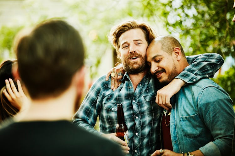 Male friends hugging