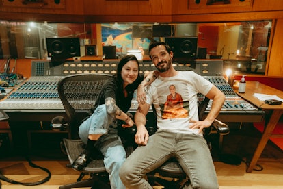 Michelle Zauner and Craig Hendrix sitting in a recording studio 