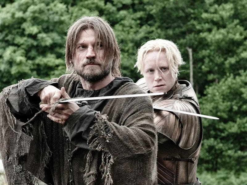 Jamie Lannister and Brienne of Tarth from Game of Thrones holding swords and pointing them straight