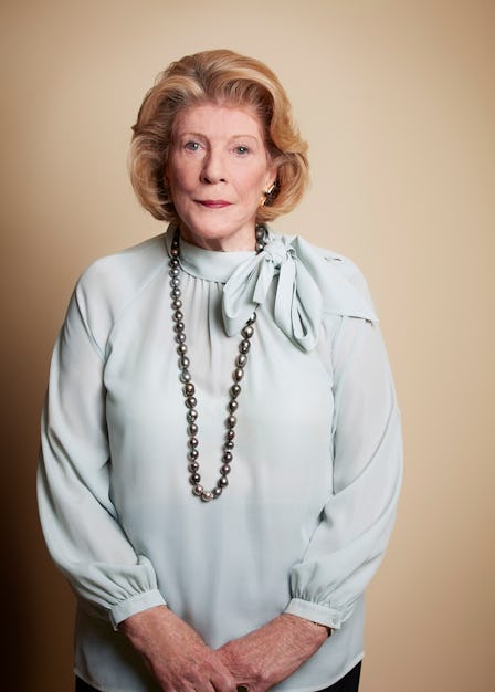 The philanthropist Agnes Gund wearing a light blue blouse and black pearls, looking pensively into t...