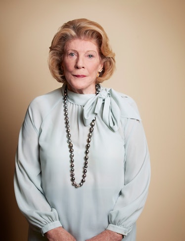 The philanthropist Agnes Gund wearing a light blue blouse and black pearls, looking pensively into t...