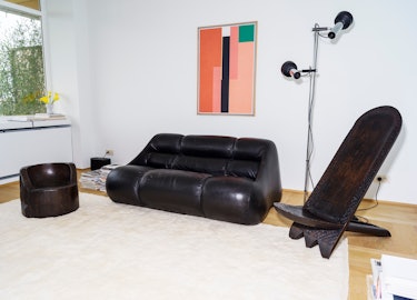 Bernard Dubois sofa, Japanese mortar stool and African chair.