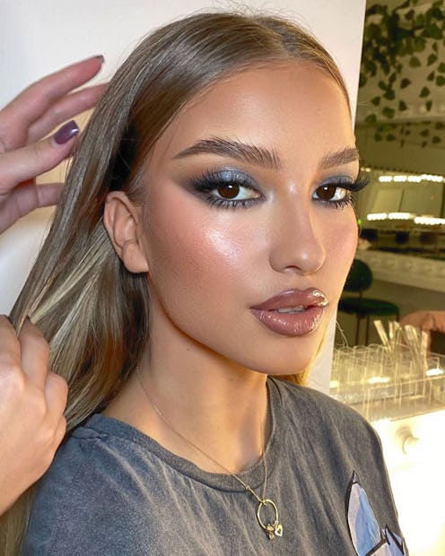 Model with smoky metallic eyeshadow and dewy blush