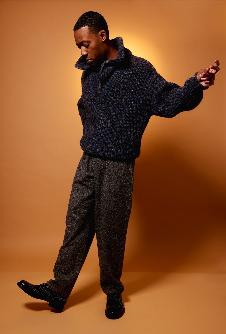 Young actor, Tyler James Williams, wearing a black sweater