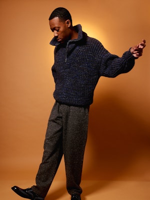 Young actor, Tyler James Williams, wearing a black sweater
