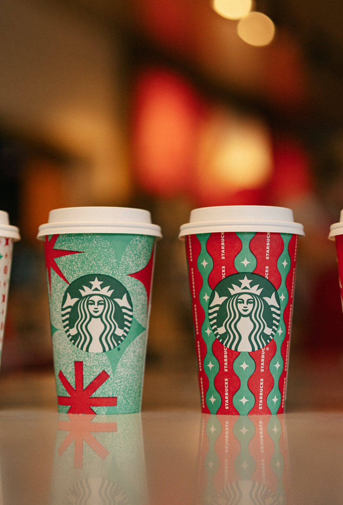 The Starbucks holiday drink menu will come served in four new red cups for the holidays.