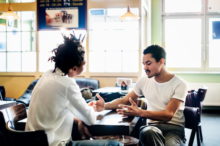Couple talking seriously at a cafe