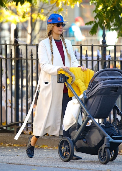 Jennifer Lawrence wearing a cream wool coat.