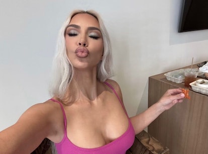 Kim Kardashian poses for a selfies after working out and doing Kim Kardashian's daily ab workout.