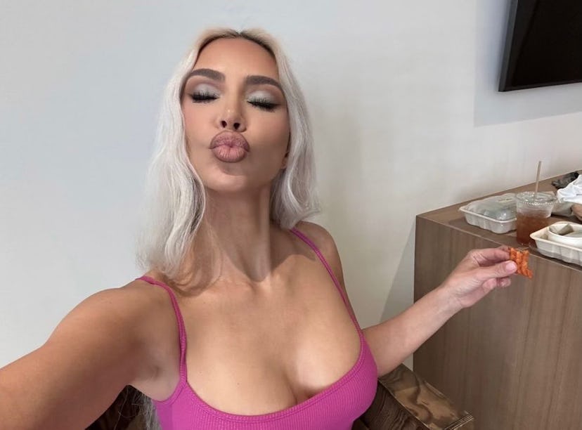 Kim Kardashian poses for a selfies after working out and doing Kim Kardashian's daily ab workout.